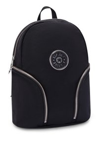 Black backpack with a rounded shape, made of soft fabric. Features silver zippers, a circular logo, and a top handle for carrying.
