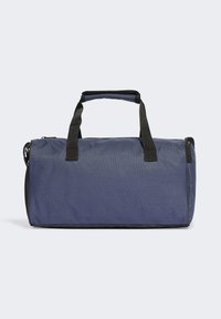 Borsa da viaggio navy realizzata in tessuto resistente. Caratterizzata da manici e cerniera neri; forma rettangolare con superficie testurizzata e tasca laterale in rete.