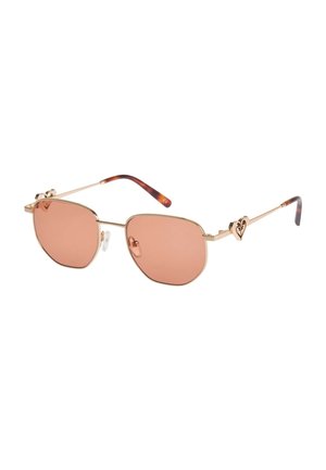 Sunglasses with gold metal frame, pink-tinted lenses, tortoiseshell temple tips, and heart-shaped decorative accents on the temples.
