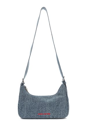 Denim shoulder bag with a curved silhouette. Features a top zip closure, adjustable strap, and red logo detail on the front.