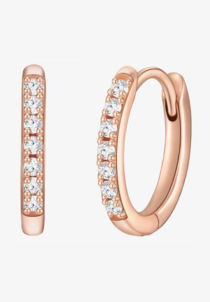 Náušnice v ružovom zlate v tvare kruhu, ktoré majú pozdĺž jednej strany rad lesklých priehľadných kryštálov. Dizajn je štíhly, s hladkým povrchom a zaoblenými hranami.