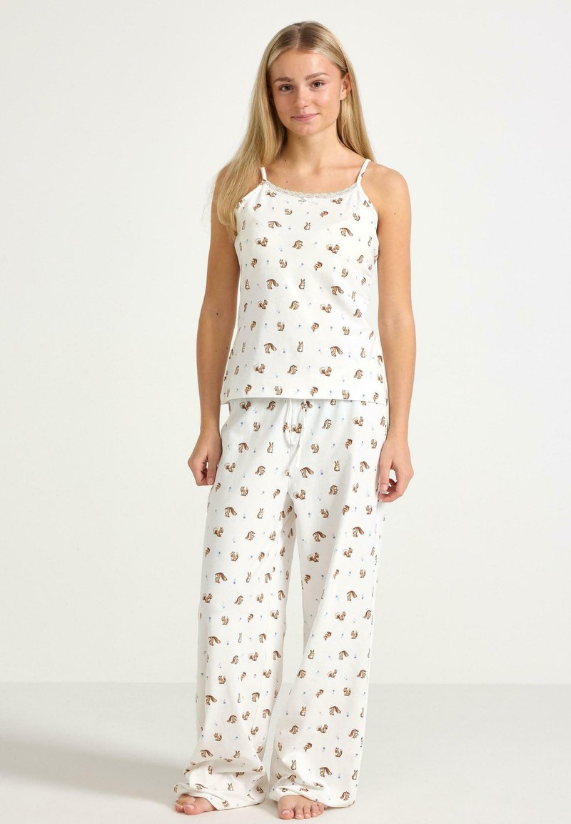 Lekki, biały bawełniany komplet piżamowy z powtarzającym się nadrukiem zwierząt. Top na ramiączkach ma cienkie paski, a spodnie posiadają elastyczną talię.