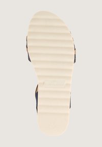 Navy sinikalla, millel on tekstuuriga kreemne kummist tall, horisontaalsed sooned ja "TOM TAILOR" logo kandmisel. Tugut mõõt 40.