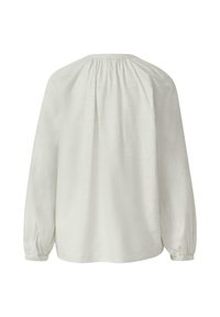 Jasnoszara bluzka z długim rękawem, ze ściąganym dekoltem, miękką teksturą i zapinanymi na guziki mankietami. Charakteryzuje się luźnym krojem i prostym designem.