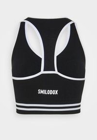 Smilodox SEAMLESS STRIPE SPORTS BRA  - Sutiã desportivo de suporte ligeiro - schwarz