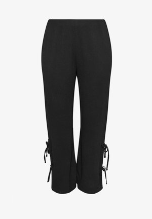 Pantaloni neri a gamba larga con vita alta e dettagli a fiocco annodati sulle parti esterne inferiori di entrambe le gambe.