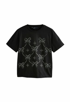 Black short-sleeve t-shirt with silver rhinestone bows and star patterns arranged in a draped design on the front.