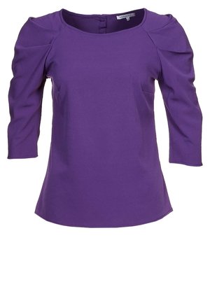 Lilla dametop med trekvartlange, puffede ærmer og rund halsudskæring, med lynlåslukning bagpå.