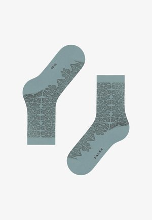 Türkis-grüne Baumwollsocken mit einem dunkelgrünen Blattmuster und verstärkten Zehen. Markenname "FALKE" nahe der Ferse.