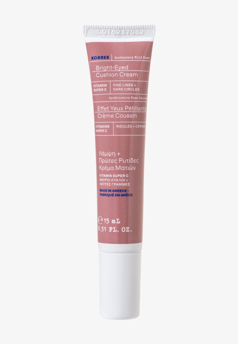 Tub av Korres Bright-Eyed Cushion Cream, rosa förpackning med vita accenter, text på flera språk, 15 mL storlek, slät matt finish.