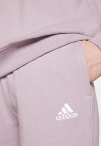adidas Sportswear Verryttelyhousut - purple