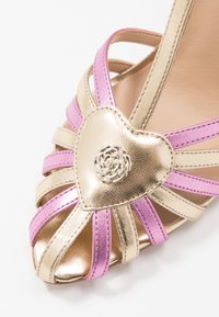 Guess Sandales à talons hauts - gold-coloured