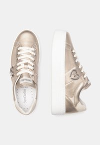 Metallic beige leather sneakers with white laces, round toe, and a textured sole. Features a silver heart-shaped accent and branding.