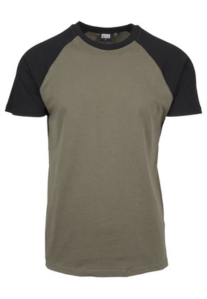 Majica s zelenim tijelom i crnim raglan rukavima. Izrađena od pamuka, ima okrugli izrez i ležeran kroj. Glatka tekstura, bez uzoraka.