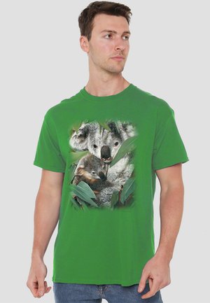 Green cotton t-shirt featuring a detailed graphic of a koala and a baby echidna among leaves. Short sleeves and a crew neck design.