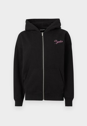 Black zip-up hoodie with a front zipper, two large pockets, and a pink embroidered logo on the chest. Made of textured cotton fabric.