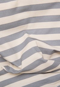 Cotton fabric with horizontal stripes in grey and cream, featuring a soft, textured surface with a slight drape.