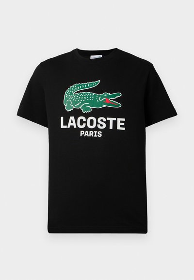 Черна памучна тениска с лого на зелена крокодил и текст "LACOSTE PARIS" в бяло. С къси ръкави и класически кръгъл врат.