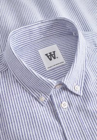 Blue and white striped shirt with a button-down collar, white buttons, and a tag labeled "DOUBLE W by WOOD WOOD."