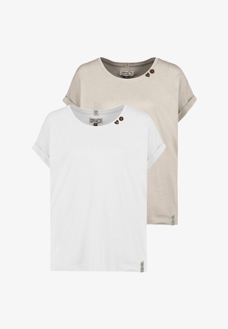 Two short-sleeve t-shirts, one white and one beige. Both feature a round neckline, rolled sleeves, and decorative buttons near the shoulder.