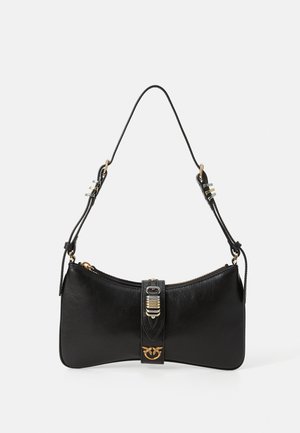 Black leather shoulder bag with adjustable strap, central gold-tone buckle detail, and small gold brand emblem on front lower center.