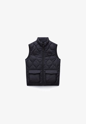 Black quilted sleeveless vest with front zipper and two large flap pockets, featuring a high collar and subtle stitched pattern.