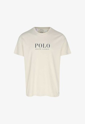 T-shirt en coton crème avec le texte "POLO RALPH LAUREN" en bleu marine, col rond, manches courtes et coupe régulière.