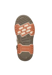Zool van een sneaker met een gestructureerde grijze rubberen basis en oranje en witte patroonaccenten voor verbeterde grip en tractie.