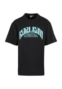 Black cotton T-shirt featuring bold turquoise "KARLISANI INTERNATIONAL" text in an arched design, short sleeves, and a crew neckline.