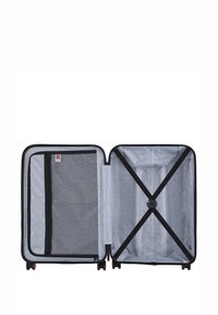 Black wheeled suitcase open to reveal a grey interior, featuring a mesh pocket and crisscross straps for securing contents.