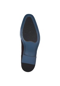 Schuhsohle mit einer gebogenen, dunklen Gummisohle und einem blauen Akzentbereich. Verfügt über eine strukturierte Oberfläche und ein geprägtes Logo "DIGEL". Größe 42.