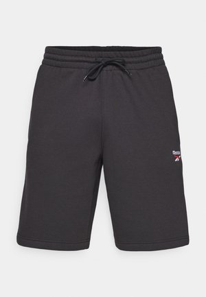 Sort sportsbukser lavet af blødt stof, med en elastisk talje og snørebånd samt et lille multikoloreret logo på siden.