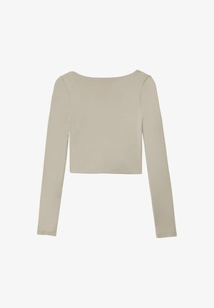 Langärmliges, kurz geschnittenes Oberteil in hellem Beige mit rundem Ausschnitt und glatter Textur, ohne Muster oder sichtbare Beschläge.