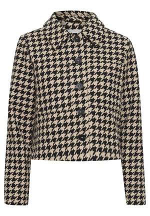 Houndstooth-mönstrad kort jacka i beige och svart, med rundad krage, framknäppning och ficka på vänster sida.