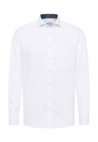 Camicia bianca con bottoni, maniche lunghe, caratterizzata da una sottile tasca sul petto e da un interno colletto decorato. Tessuto liscio, design classico.