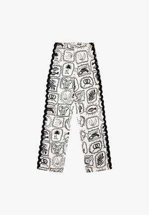 White pants with black scalloped sides, featuring black framed icons of palm trees, leaves, urns, fish, and pretzels in a repeating pattern.