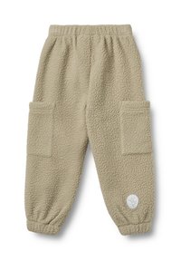 Beige Fleece-Hosen mit elastischem Bund und Bündchen, zwei großen aufgesetzten Fronttaschen und einem kleinen runden Logo-Patch in der Nähe des linken Knöchels.