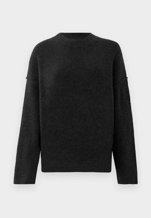 Black, loose-fit sweater made of soft, textured material. Features a round neckline and long sleeves with ribbed cuffs and hem.