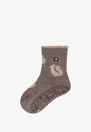 Braune Socken mit strukturiertem Strick, die Muster von Eichhörnchen und Blumen aufweisen, sowie einem gewellten oberen Rand. Gummigriffdesign an der Sohle.