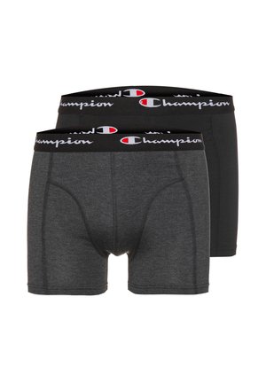 Two pairs of men's boxer briefs, one dark gray and one black, with black waistbands featuring the Champion logo in white and red.