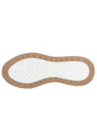 Suela de zapato con un patrón texturizado blanco, borde de goma marrón y diseño de tracción triangular para agarre y soporte.