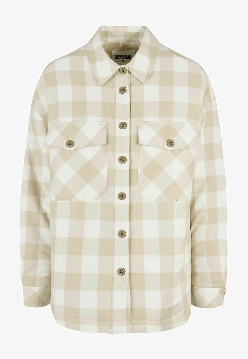 Button-up plaid shirt in beige and white. Made from fabric with a soft texture, featuring two chest pockets and brown buttons.