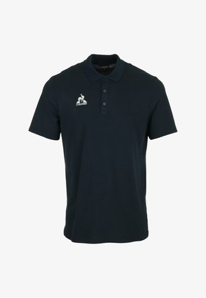 Polo shirt bleu marine en coton. Présente un col, une patte de boutonnage à trois boutons et un logo sur la poitrine gauche.