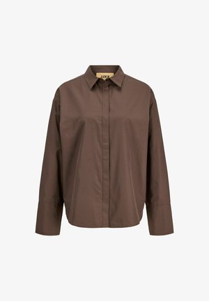 Camicia marrone con bottoni realizzata in tessuto leggero. Caratterizzata da un colletto a punta, maniche lunghe e una vestibilità rilassata. Texture liscia.