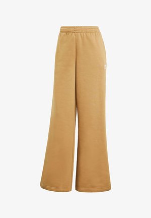 Pantalones de chándal de pierna ancha en color beige, confeccionados con un tejido suave, con una cinturilla elástica y un discreto logo blanco en el lateral.