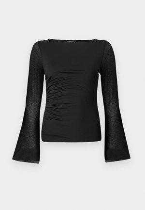 Haut noir à manches longues avec devant froncé et manches cloche transparentes, col rond et silhouette ajustée.