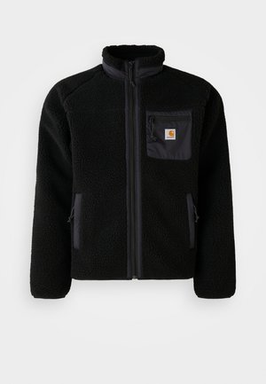 Giacca in pile nera con zip frontale, colletto alto e tessuto strutturato. Presenta una tasca sul petto e tasche laterali con chiusura a zip.