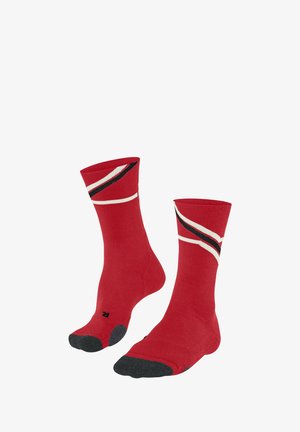 Rote Socken mit schwarz-weißen diagonalen Streifen, ausgestattet mit einer verstärkten schwarzen Zehenpartie. Gerippte Textur am Bund.