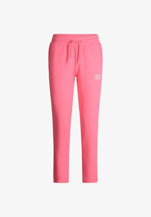 Różowe spodnie dresowe z ściągaczem w talii, o wąskich, zwężanych nogawkach oraz małym białym logo "Joop! Jeans" na lewej udzie.