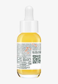 Transparent glasdropperflaska med ett vitt lock, som innehåller 30 ml gult serum. Etiketten har flerspråkig text och en QR-kod.